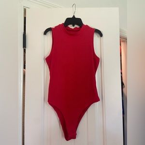 Red turtle neck body suit